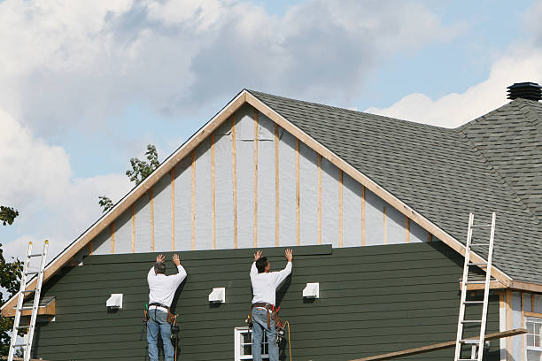 Professional Siding technician working in Port Washington, NY